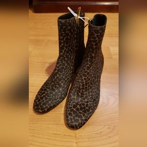 Michael Kors cheeta print, real leather never been worn.